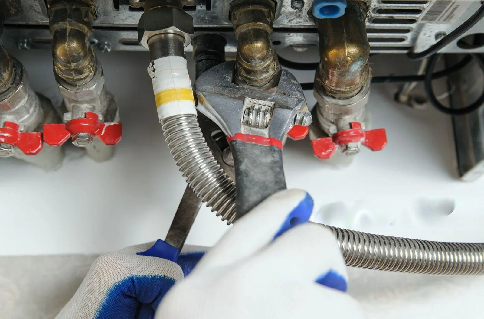 Plumber repairing water heater